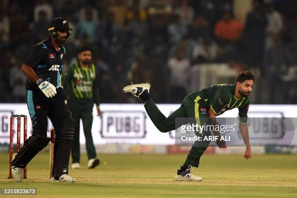 Pakistan's Haris Rauf delivers a ball during the first Twenty20 cricket match between Pakistan and New Zealand at the Gaddafi Cricket Stadium in...