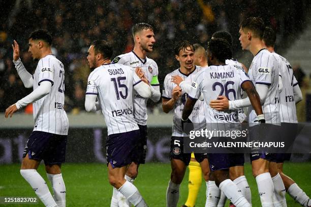 Toulouse's players celebrate scoring the team's first goal during the French L1 football match between Toulouse FC and Lyon at The TFC Stadium in...