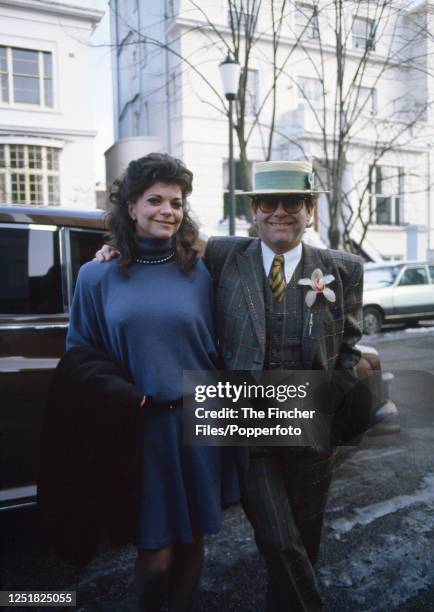 British singer, pianist and composer Elton John with his wife, the German recording engineer Renate Blauel, in London, circa 1985.