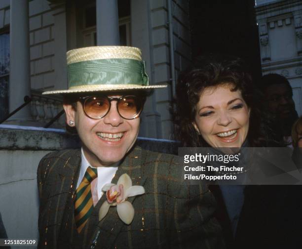 British singer, pianist and composer Elton John with his wife, the German recording engineer Renate Blauel, in London, circa 1985.