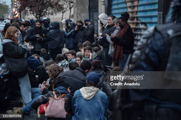 Riot police arrest demonstrators set priot to a protest against the government after pushing the pensions reform without a vote using article 49.3 of...