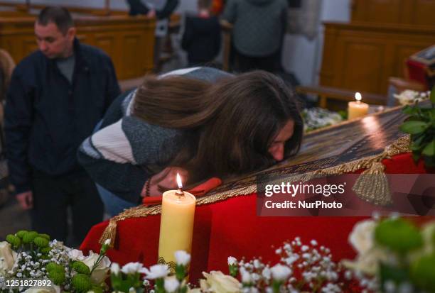 Worshipper reverently kisses the Holy Shroud during the Good Friday service at the Dormition of the Virgin Mary Greek Catholic parish, on April 14 in...