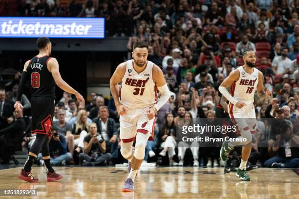 Max Strus of the Miami Heat celebrates after making a three-point shot against the Chicago Bulls at Kaseya Center on April 14, 2023 in Miami,...