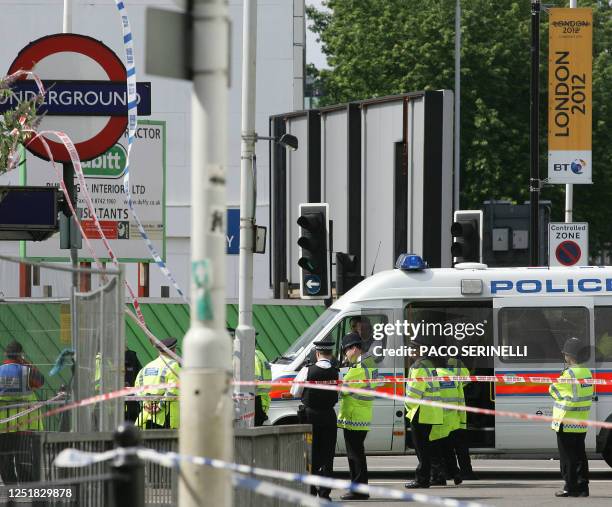 Police maintain a security cordone at Aldgate Station after terrorist attacks in London 07 July 2005. Explosions ripped through three underground...