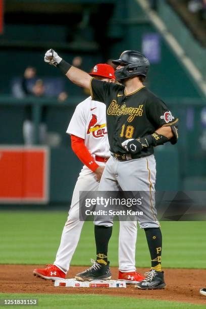 Austin Hedges of the Pittsburgh Pirates gestures toward the dugout after hitting a double during the fifth inning against the St. Louis Cardinals at...