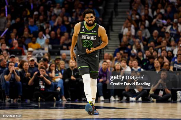 Karl-Anthony Towns of the Minnesota Timberwolves reacts to a wrist injury against the Oklahoma City Thunder in the second quarter of the NBA Play-In...