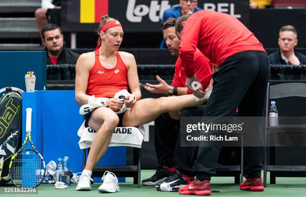 Yanina Wickmayer of Belgium gets her ankled taped during the first match against Leylah Annie Fernandez of Canada on Day 1 of the Billie Jean King...