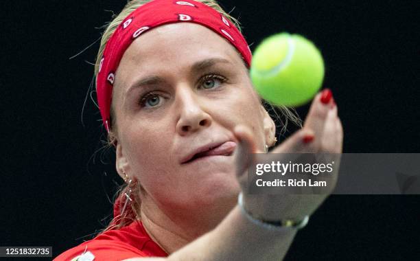 Ysaline Bonaventure of Belgium tosses the ball as she serves during her match against Rebecca Marino of Canada on Day 1 of the Billie Jean King Cup...