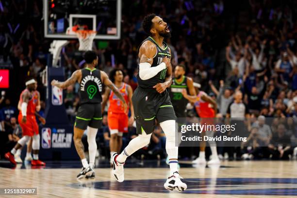 Mike Conley of the Minnesota Timberwolves celebrates his three-point basket against the Oklahoma City Thunder in the fourth quarter of the NBA...