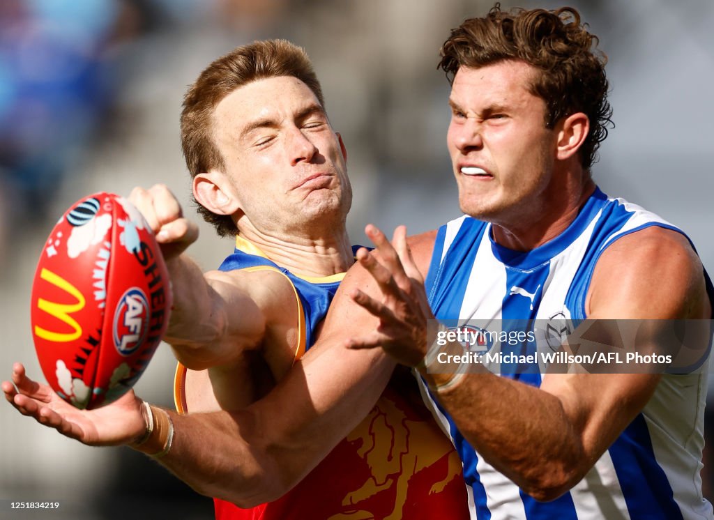 Combven Harris Andrews of the Lions and Charlie Comben of the Kangaroos in ...