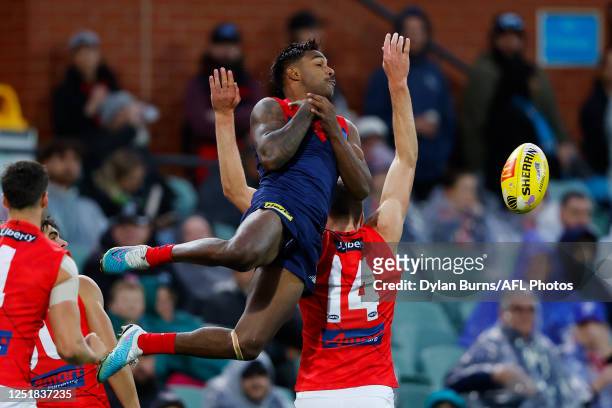 Kysaiah Pickett of the Demons attempts to mark the ball during the 2023 AFL Round 05 match between the Essendon Bombers and the Melbourne Demons at...