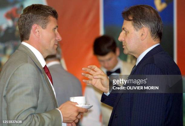 Belgian IOC member and candidate for the presidency Jacques Rogge chats with Ukrainian IOC member and legendary pole vaulter Sergei Bubka 14 July...