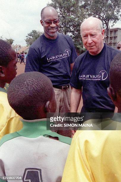 Former England football player Manchester United Director Sir Bobby Charlton and American Olympic Gold medalist Edwin Moses, introduce themselves to...