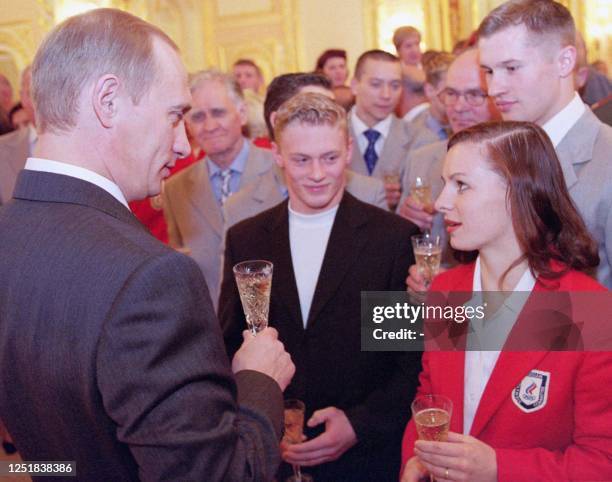 Russian President Vladimir Putin toasts during his meeting with the Russian national Olympic team in Moscow, 06 October 2000. Vladimir Putin...