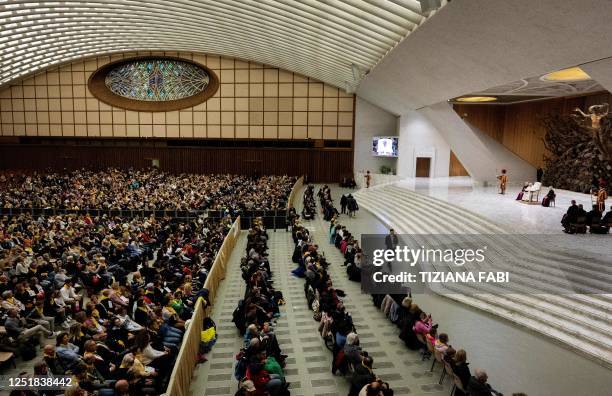 Pope Francis meets pilgrims from the diocese of Crema during an audience at the Paul VI hall in the Vatican on April 15, 2023.