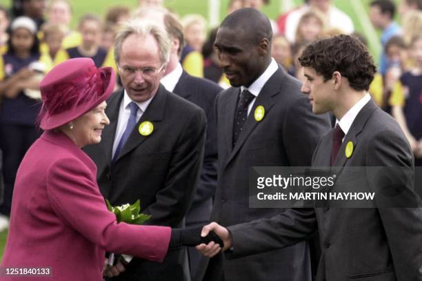 Britain's Queen Elizabeth II shakes hands with Owen Hargreaves who plays for Bayern Munich as Sol Campbell of Arsenal FC and Sweden' Sven-Goran...