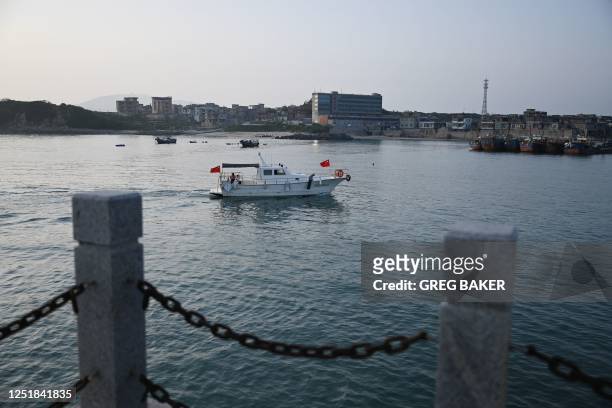 Tour boat enters a harbour on Pingtan island, the closest point in China to Taiwan, in China's southeast Fujian province on April 15, 2023.