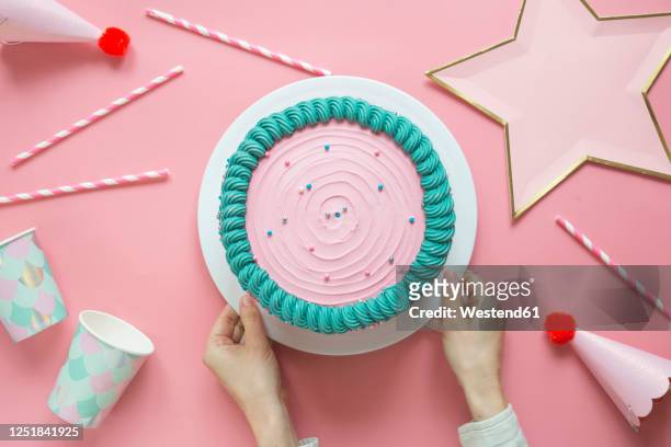 hands of woman preparing birthday cake - birthday cake stock pictures, royalty-free photos & images