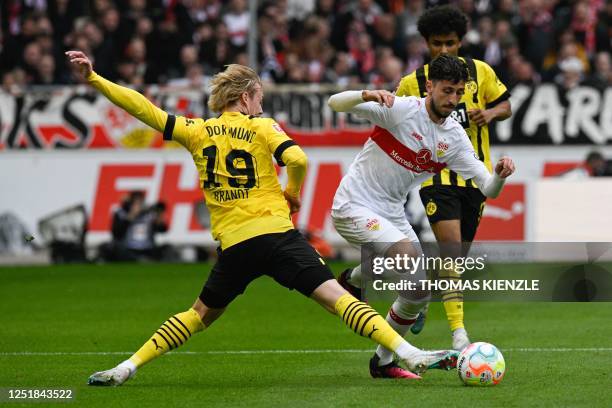 Stuttgart's German defender Atakan Karazor and Dortmund's German midfielder Julian Brandt vie for the ball during the German first division...