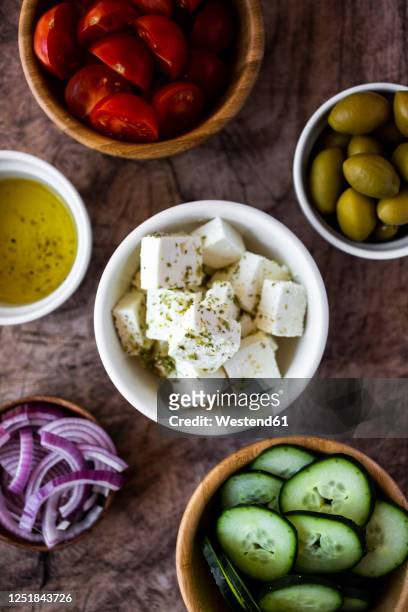 bowls with fresh ingredients for greek salad - feta stock pictures, royalty-free photos & images