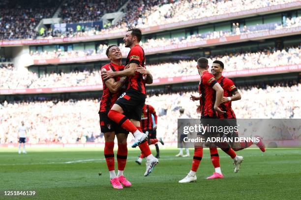 Bournemouth's Uruguayan defender Matias Vina celebrates with teammates after scoring his team first goal during the English Premier League football...