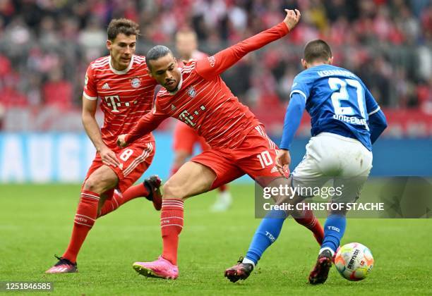 Bayern Munich's midfielder Leon Goretzka, Bayern Munich's midfielder Leroy Sane and Hoffenheim's Croatia's striker Andrej Kramaric vie for the ball...