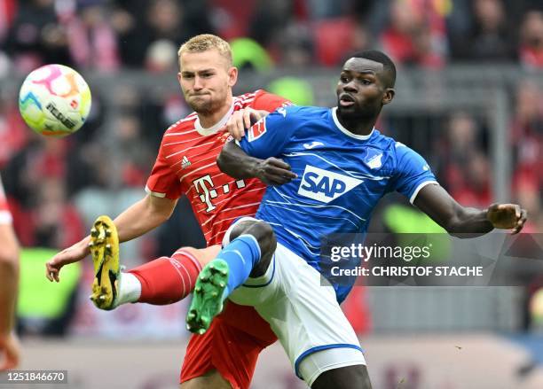 Bayern Munich's Dutch defender Matthijs de Ligt and Hoffenheim's French defender Stanley Nsoki vie for the ball during the German first division...