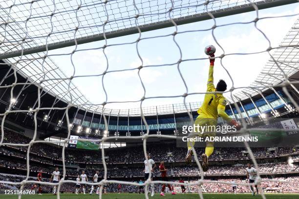 Tottenham Hotspur's French goalkeeper Hugo Lloris makes a save during the English Premier League football match between Tottenham Hotspur and...