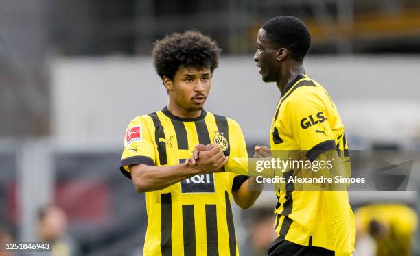 Karim Adeyemi and Soumaila Coulibaly of Borussia Dortmund during the Bundesliga match between VfB Stuttgart and Borussia Dortmund at Mercedes-Benz...