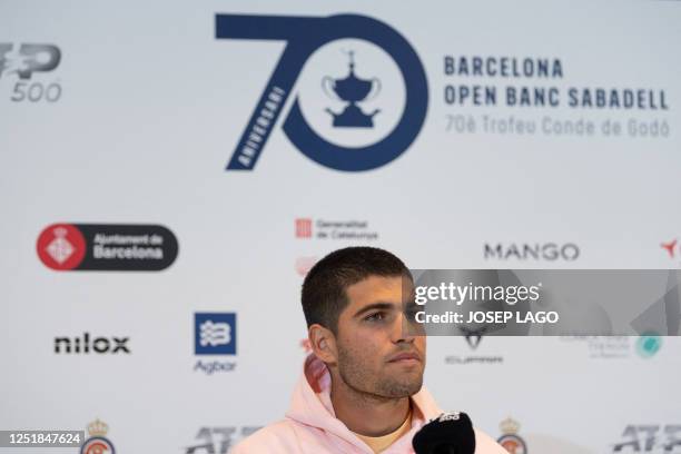 Spain's Carlos Alcaraz addresses a press conference on the first day of the ATP Barcelona Open tennis tournament at the Real Club de Tenis in...