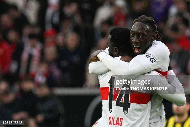 Stuttgart's Congolese midfielder Silas and Stuttgart's French midfielder Tanguy Coulibaly celebrate after the end of the German first division...