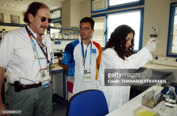 International Olympic Committee medical director Patrick Schamasch, left, visits the Doping Control Laboratory of Athens, 02 August 2004. Some 500...