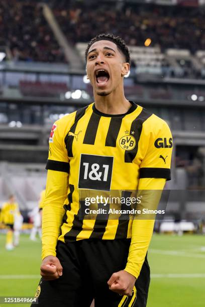 Jude Bellingham of Borussia Dortmund is celebrating a goal from Giovanni Reyna during the Bundesliga match between VfB Stuttgart and Borussia...