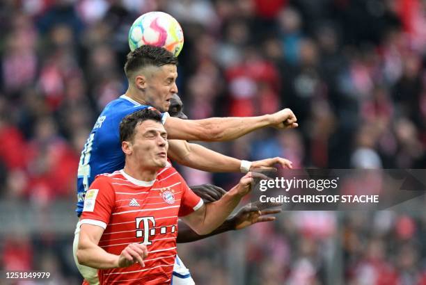 Hoffenheim's Austrian midfielder Christoph Baumgartner , Bayern Munich's French defender Dayot Upamecano and Bayern Munich's French defender Benjamin...