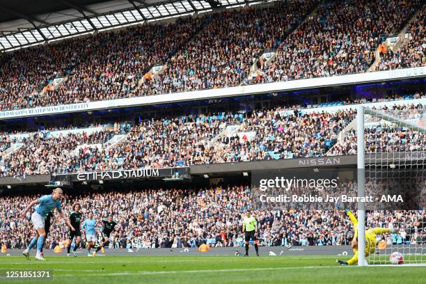 Erling Haaland of Manchester City scores a goal to make it 2-0 during the Premier League match between Manchester City and Leicester City at Etihad...