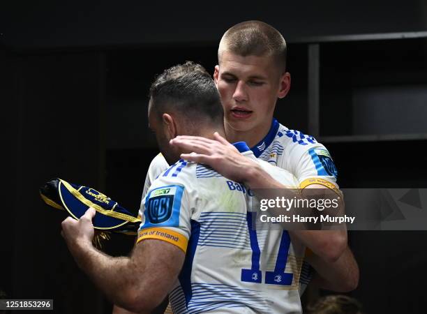 Gauteng , South Africa - 15 April 2023; Sam Prendergast of Leinster is presented his first cap by teammate Dave Kearney after their side's victory in...