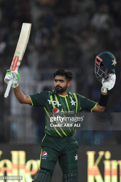 Pakistan's captain Babar Azam celebrates his century during the second Twenty20 cricket match between Pakistan and New Zealand at the Gaddafi Cricket...