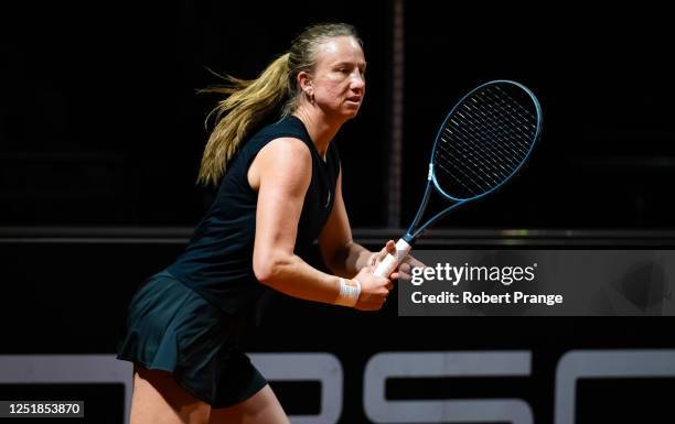 Mona Barthel of Germany in action against Ylena In-Albon of Switzerland during her first-round qualifications match ahead of the Porsche Tennis Grand...