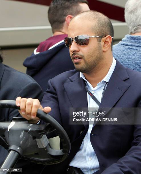 Sheikh Maktoum Hasher, Founder, President and Chairman of A1 Grand Prix, drives a buggy through the pit lane before open practice at Brands Hatch 23...