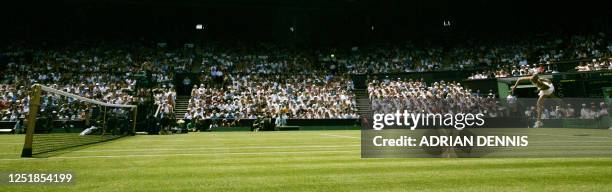 Defending Wimbledon Ladies champion Maria Sharapova of Russia serves to Nuna Llagostera Vives of Spain during their first round match at the 119th...