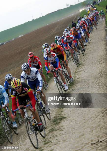 The pack rides during the 103rd Paris-Roubaix cycling race, 10 April 2005 between Compiegne and Roubaix. Belgian Tom Boonen won the race ahead of US...