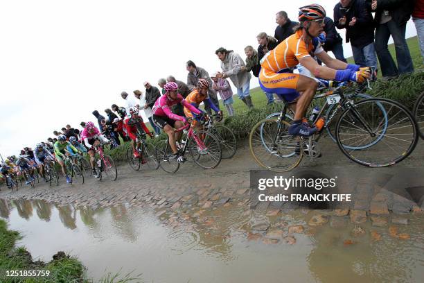 The pack rides during the 103rd Paris-Roubaix cycling race, 10 April 2005 between Compiegne and Roubaix. Belgian Tom Boonen won the race ahead of US...