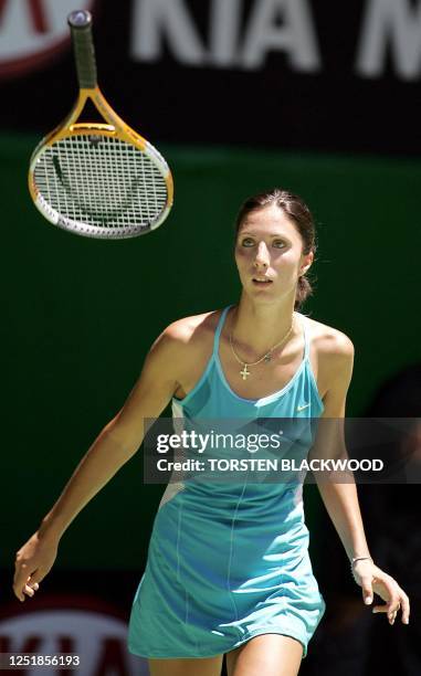 Third seeded Anastasia Myskina of Russia tosses her racket into the air while against Kveta Peschke of the Czech Republic in their women's singles...