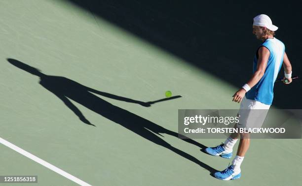 Third seed Lleyton Hewitt of Australia prepares to serve against Rafael Nadal of Spain in their men's singles fourth round match at the 2005...