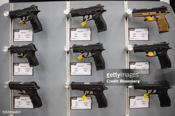 Handguns displayed at the Taurus booth during the National Rifle Association annual convention in Indianapolis, Indiana, US, on Saturday, April 15,...