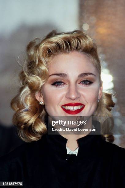 Singer Madonna holds a Press Conference with former Beatle George Harrison for their film 'Shanghai Surprise' at the Kensington Roof Gardens in...