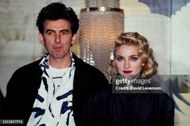 Singer Madonna holds a Press Conference with former Beatle George Harrison for their film 'Shanghai Surprise' at the Kensington Roof Gardens in...