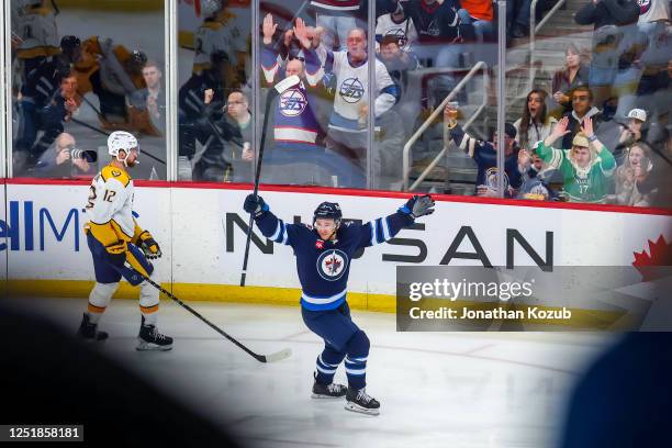 Neal Pionk of the Winnipeg Jets celebrates his third period goal against the Nashville Predators at Canada Life Centre on April 08, 2023 in Winnipeg,...