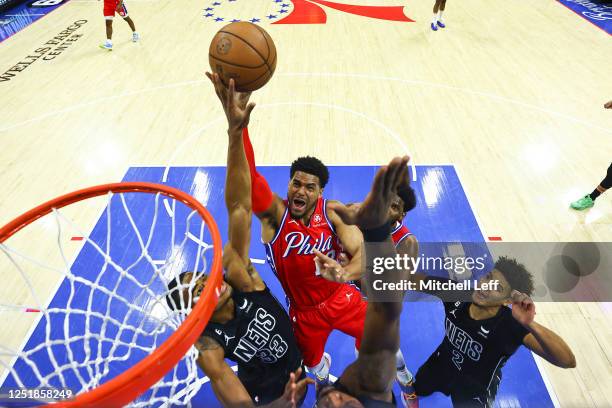 Tobias Harris of the Philadelphia 76ers shoots the ball against Nic Claxton and Cameron Johnson of the Brooklyn Nets in the first quarter during Game...