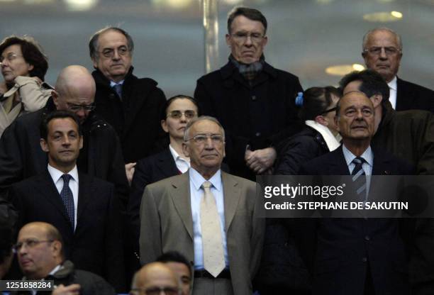 French Interior minister Nicolas Sarkozy, French president Jacques Chirac and French football federation president Jean-Pierre Escalettes are...